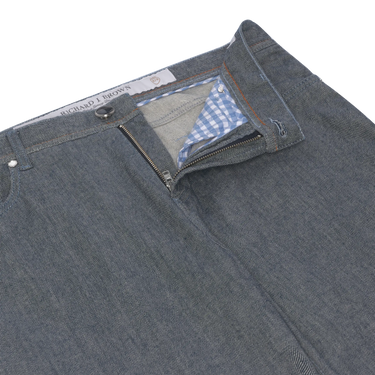 Close-up of Richard J. Brown Blue Melange Jeans zipper and waistband, highlighting premium stitching and gingham inner lining. Designed for comfort and style.