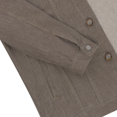 Close-up of sleeve and button detail on Richard J. Brown brown melange denim jacket, highlighting craftsmanship and textured cotton fabric.