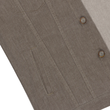 Detailed view of front pocket and button stitching on Richard J. Brown denim cotton jacket in brown melange, emphasizing quality design.