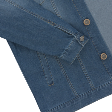 Detailed view of Richard J. Brown denim jacket sleeve and button cuff, emphasizing high-quality cotton-blend fabric and design.