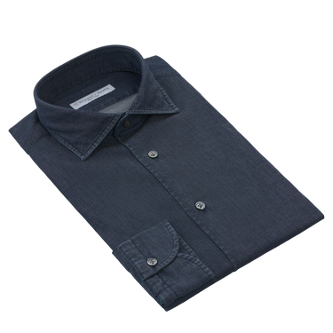 Richard J. Brown cotton denim dark blue shirt neatly folded with visible collar and cuff, ideal for smart-casual summer wear.