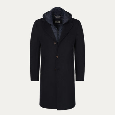 Abrigo con capucha en azul oscuro con inserción desmontable de protección contra el viento